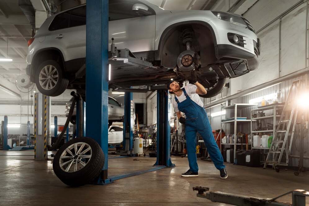 mechanic-working-car-suspension-issues