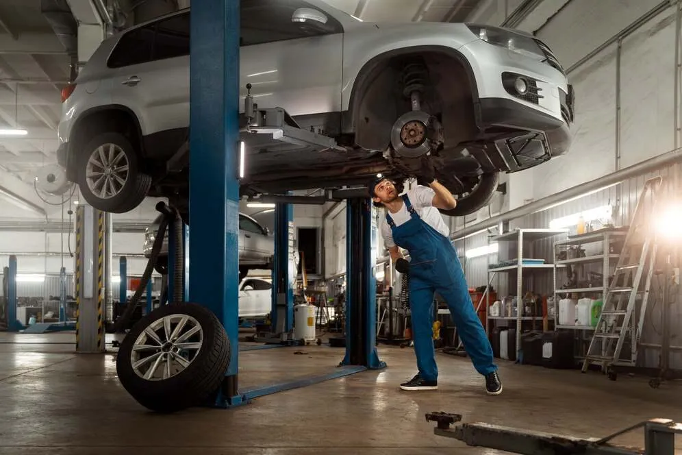 mechanic-working-car-suspension-issues